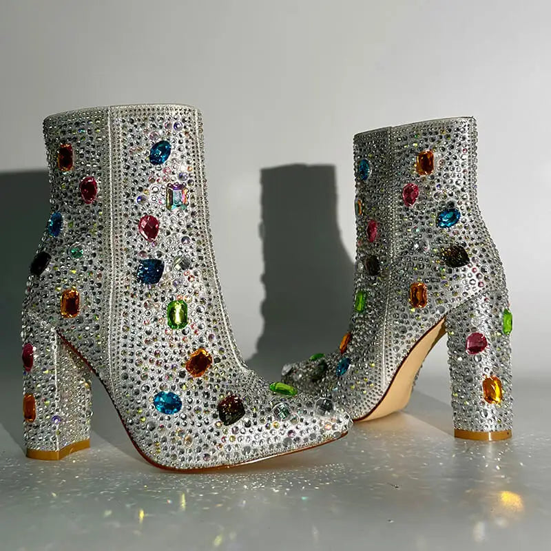 Pair of rhinestone embellished pointed toe ankle boots with block heels