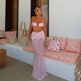 Pink bikini top and sheer maxi skirt