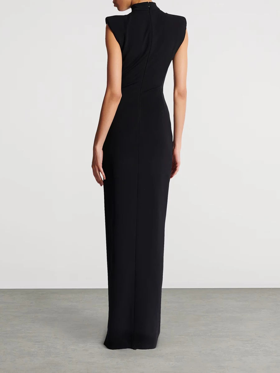 Black evening gown on a plain background