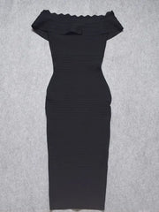 Black off-shoulder dress on a gray background