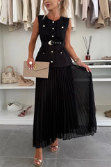 Woman wearing a black dress with gold buttons in a clothing store.