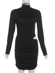 Black dress with long sleeves on a mannequin against a white background