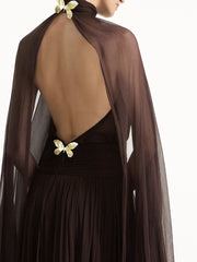 Brown sheer dress with butterfly embellishments on a white background
