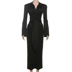 Black dress on a mannequin against a white background
