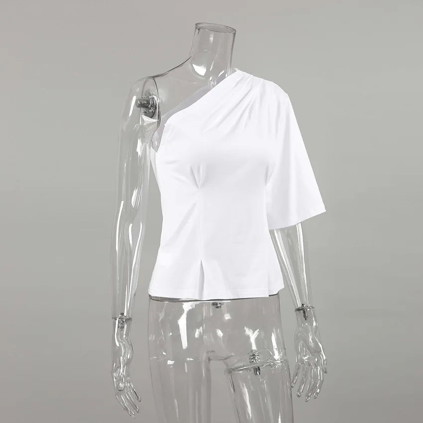 White one-shoulder top on a transparent mannequin against a gray background