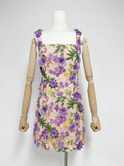 Floral dress on a mannequin against a white background