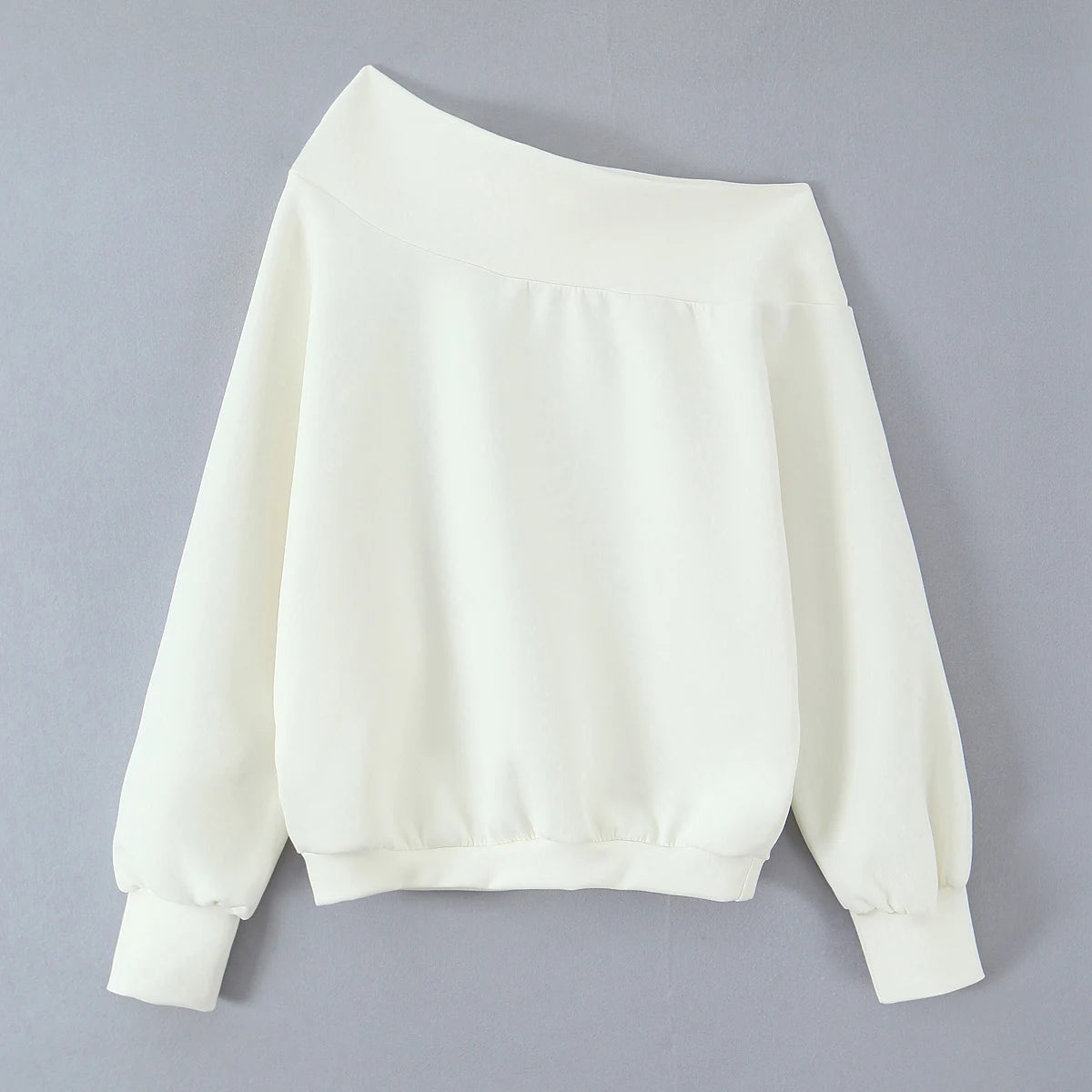 White sweatshirt on a gray background