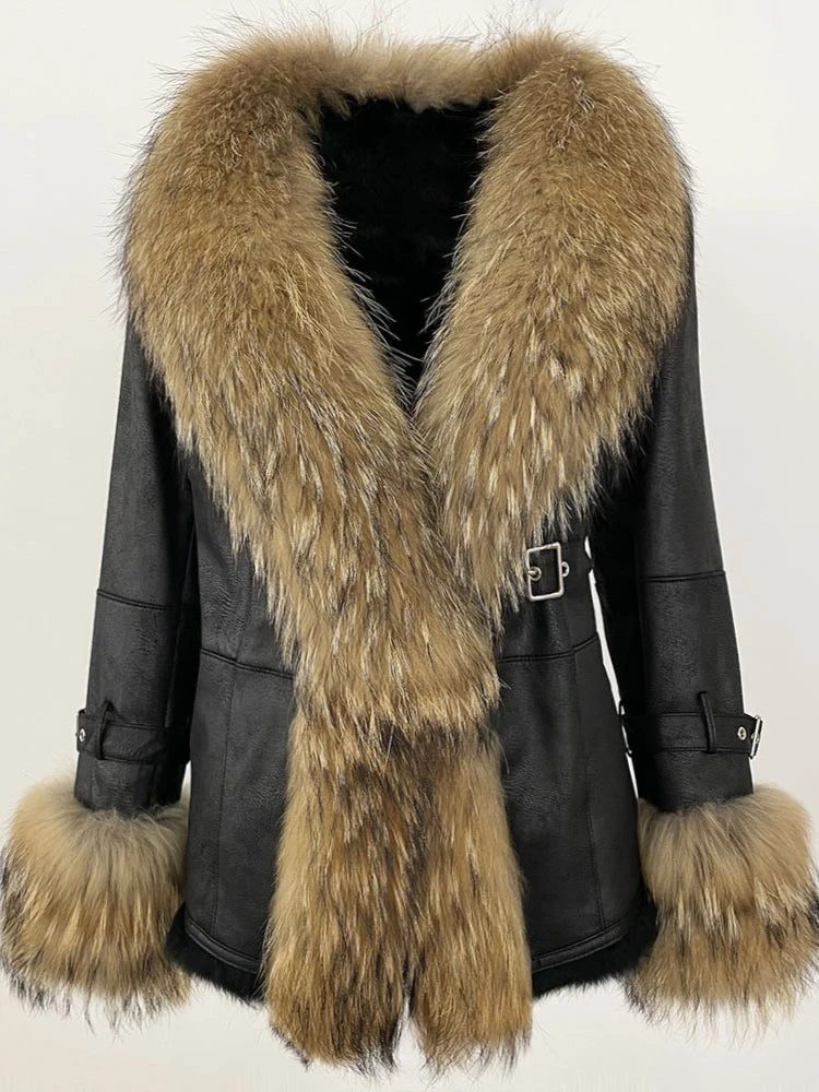 Black shearling coat with a prominent tan and brown raccoon dog fur collar and matching cuffs.
