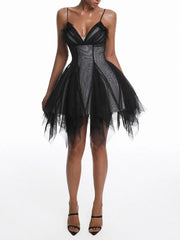 Front view of black mesh asymmetrical v-neck mini dress showing hem detail