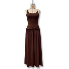 Brown dress on a mannequin against a white background
