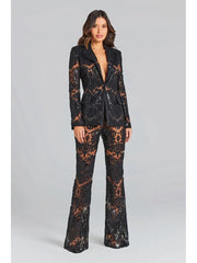 Black sequin embroidered lace blazer and flare pants set worn by a model.