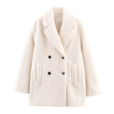 White coat with black buttons on a white background
