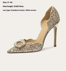 Gold glitter high-heeled shoe with bow detail on a white background,