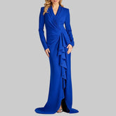 Blue evening gown with ruffled details on a white background