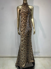 Leopard print evening gown on a mannequin against a white background