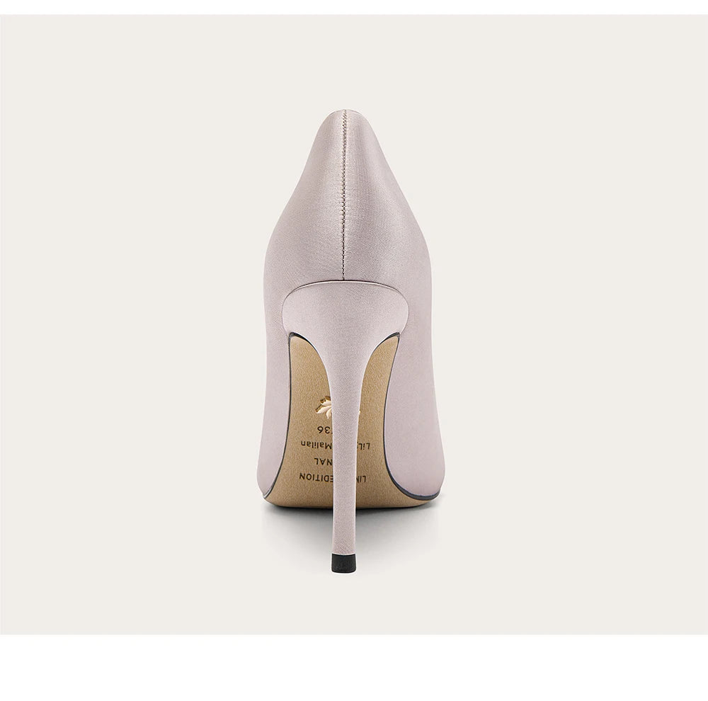 Light gray high-heeled shoe on a white background
