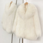 White fluffy coat on a hanger against a white background