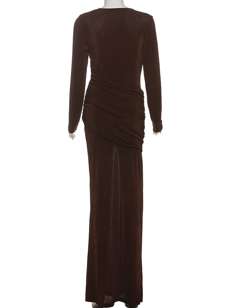 Brown evening gown on a mannequin against a white background