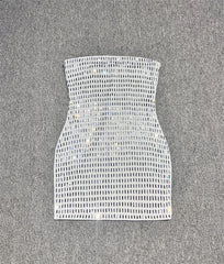 White strapless top with a grid pattern on a grey background