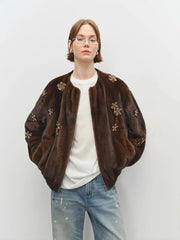 Back view of brown faux fur bomber jacket with gathered hem