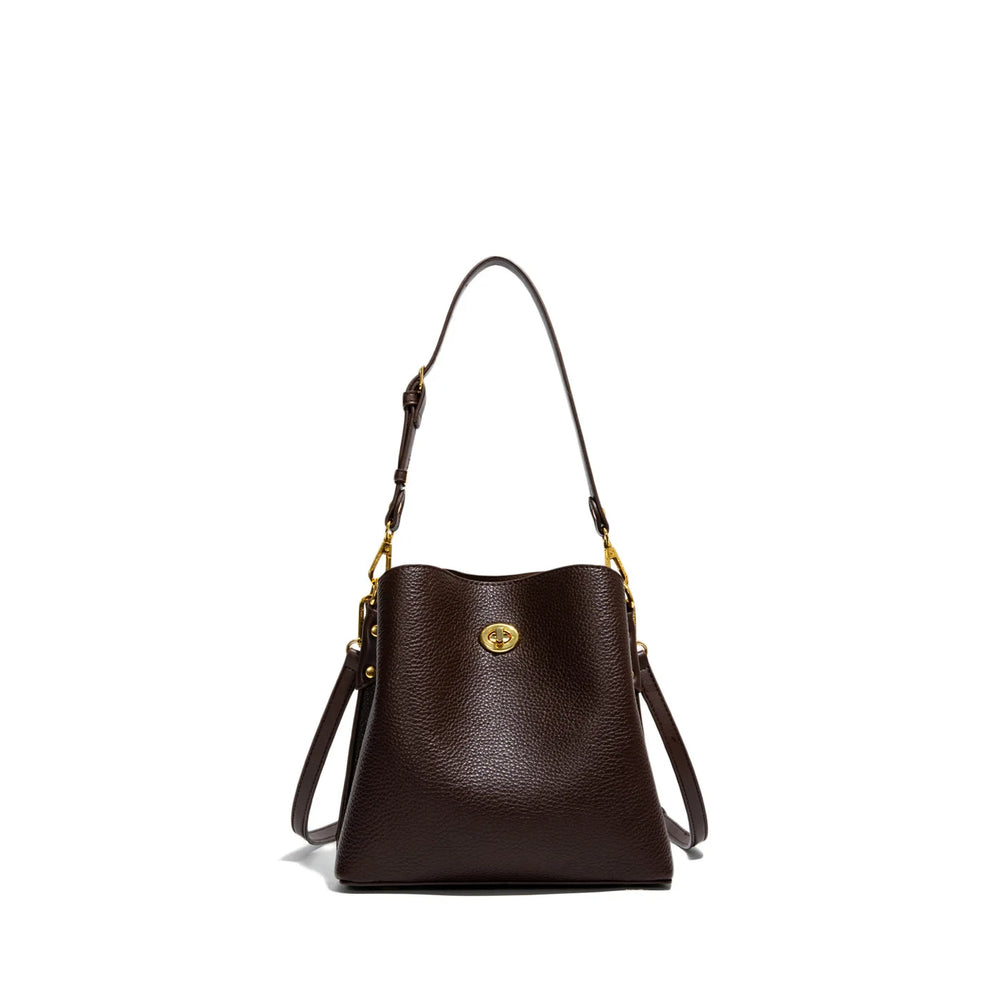 Brown leather handbag with gold clasp on a white background