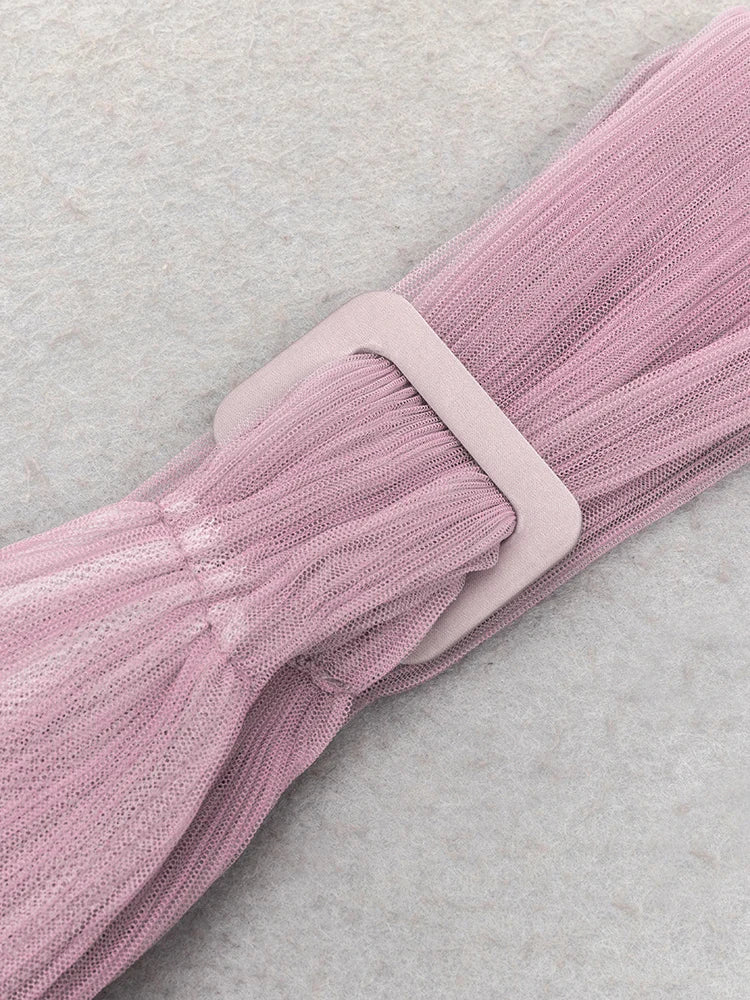 Pink textured belt with a buckle on a light gray background