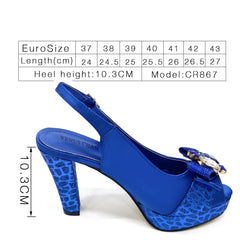 Blue high-heeled shoe with decorative bow and size chart on a white background