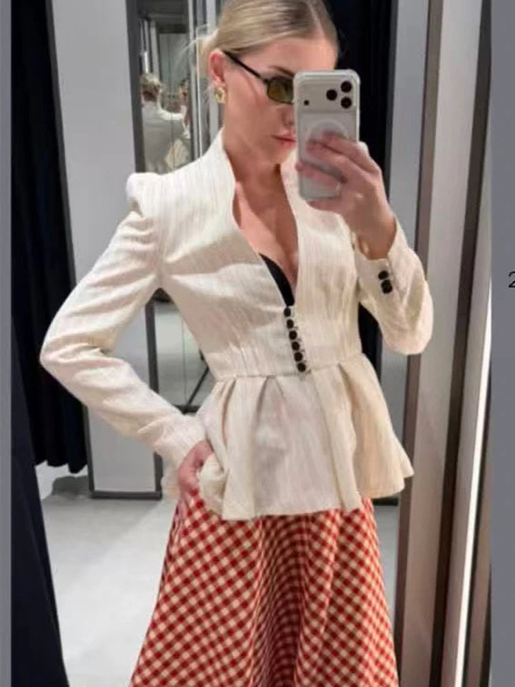 Striped peplum blazer jacket worn by a model.
