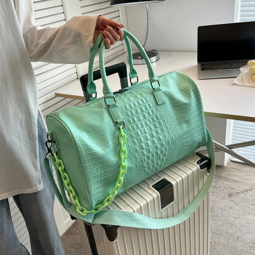 Mint green crocodile embossed travel duffle bag