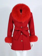 Red coat with fur trim on a white background
