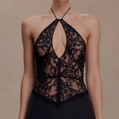 Close-up of black floral lace halter bustier top neckline.