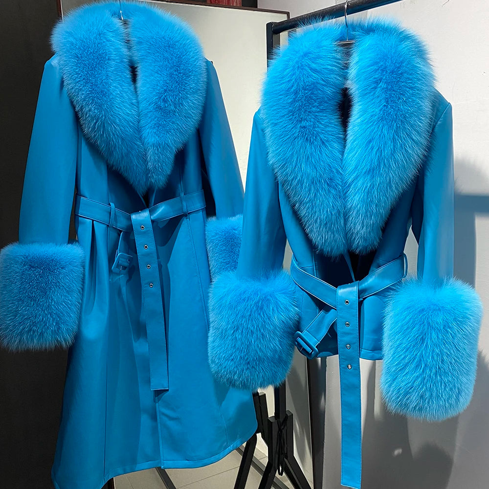 Blue coat with fur trim on a mannequin against a neutral background