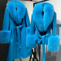 Blue coat with fur trim on a mannequin against a neutral background