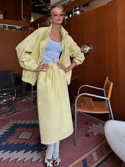 Interior view of yellow utility jacket and midi skirt set