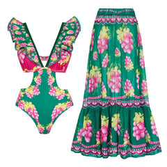 Green swimsuit with cut-out details and grape print, with a matching maxi skirt
