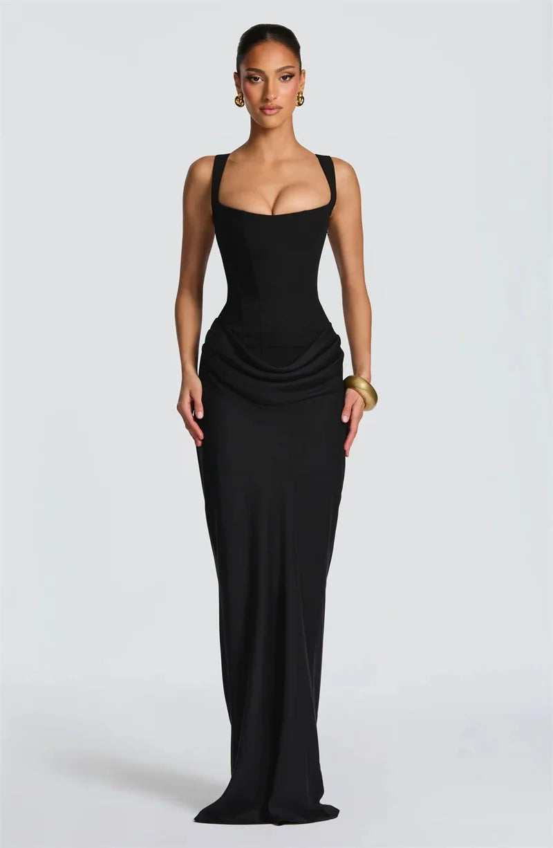 Woman wearing a black evening gown on a white background