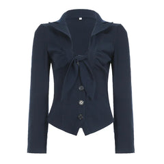 Navy blue top with a bow detail on a white background