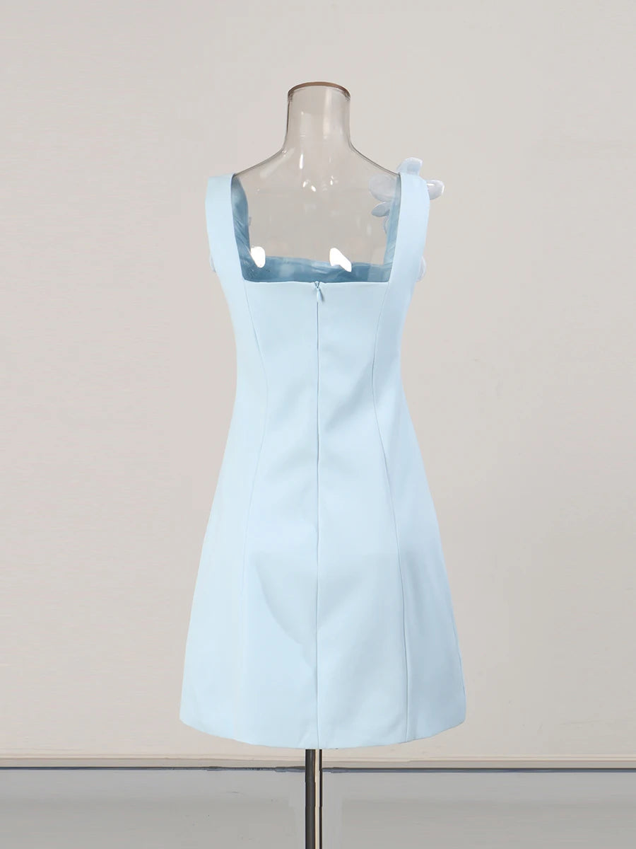 Light blue dress on a mannequin against a plain background
