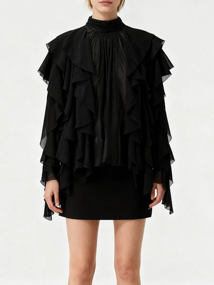 Black ruffled dress on a white background