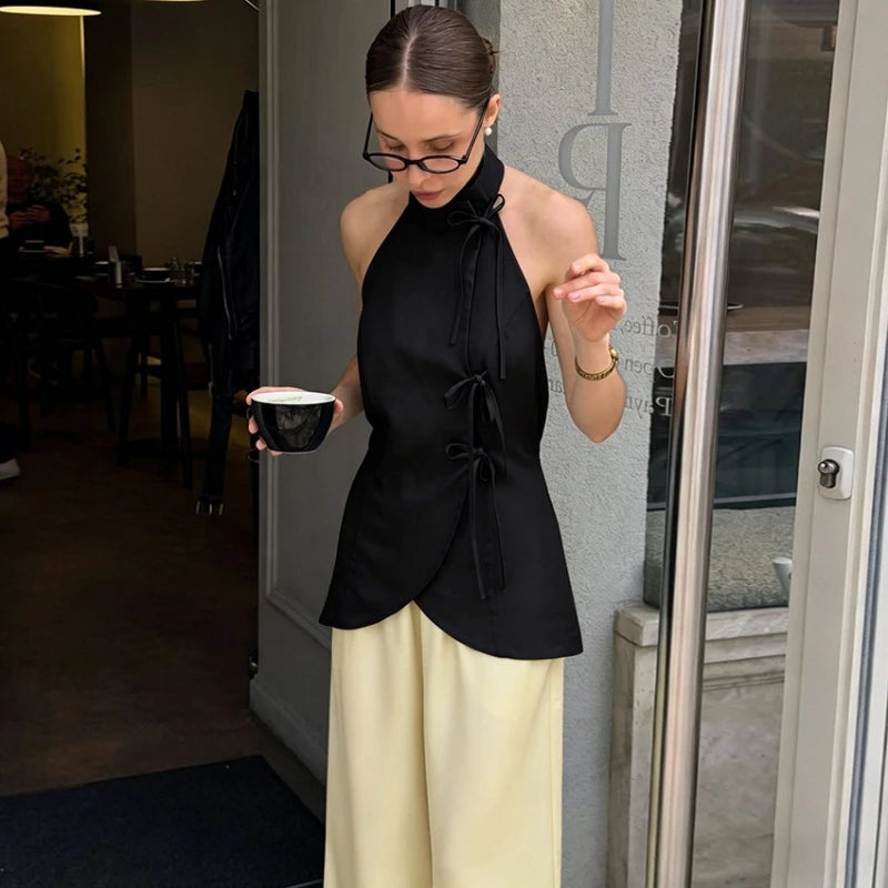 Black sleeveless high neck top with lace up waist detail