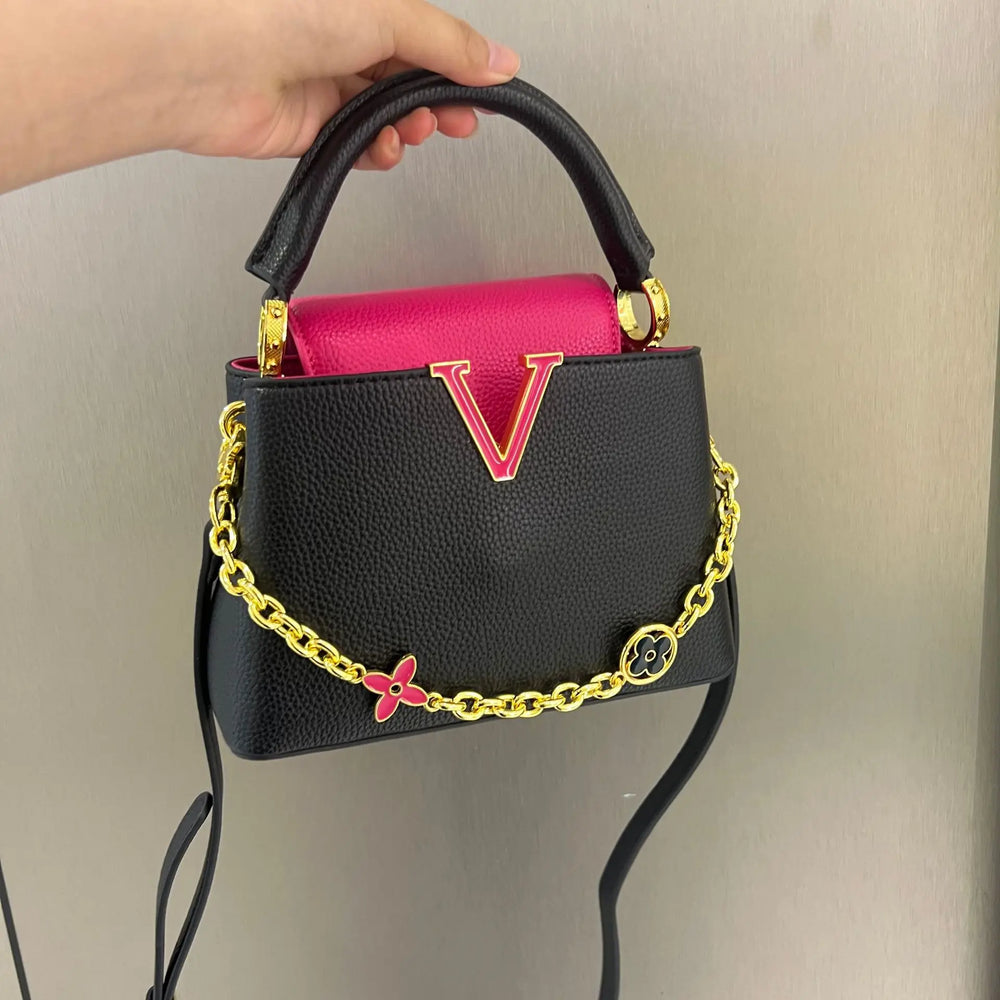 Black and pink structured chain embellished bag