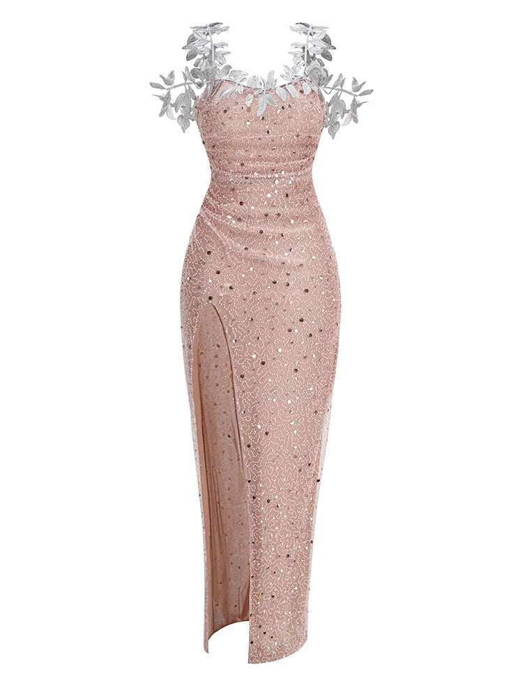 Rose gold evening gown with silver floral embellishments on a white background