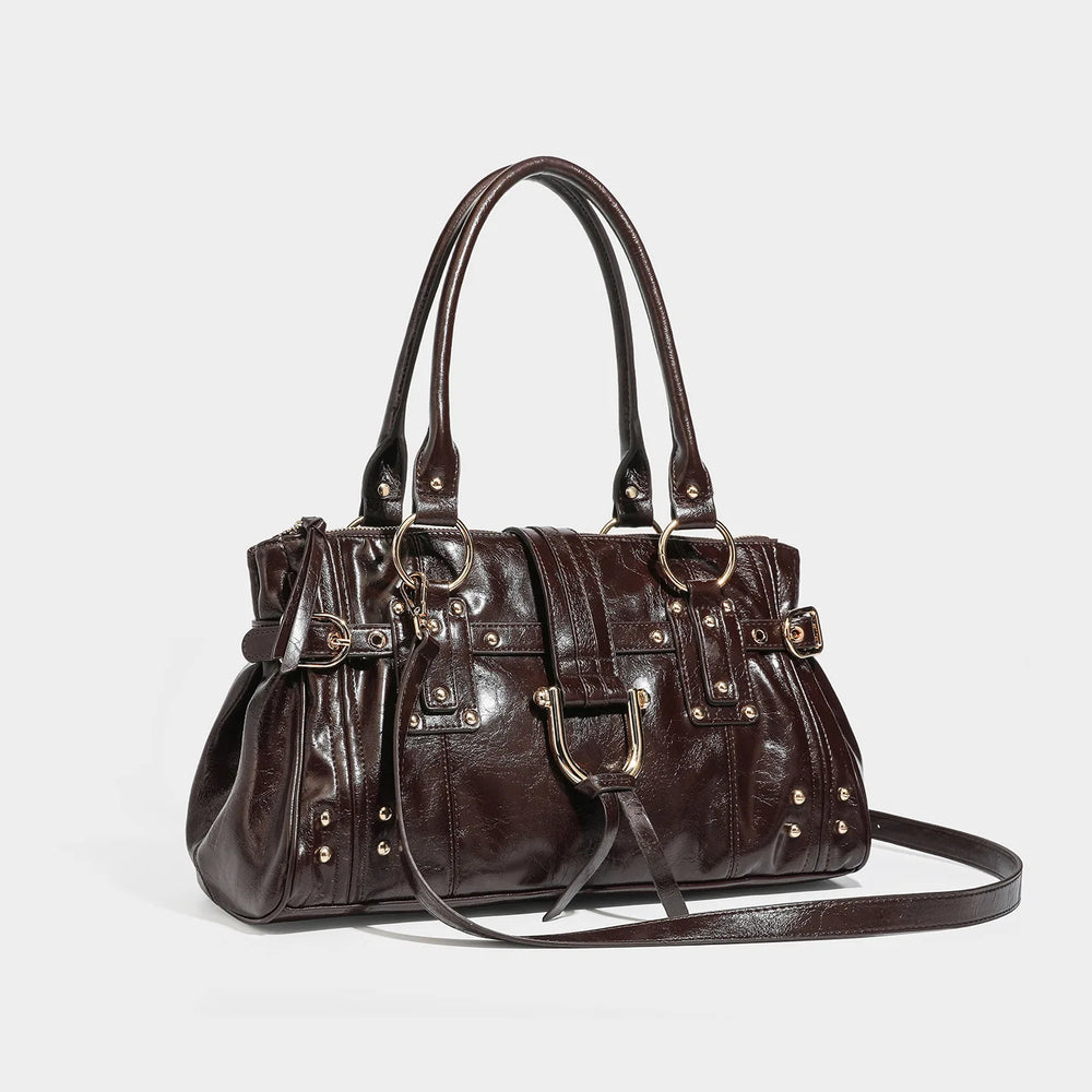Brown structured shoulder bag with gold-tone hardware and lock charm, angled view