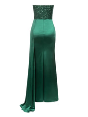 Green evening gown with sequined top on a white background