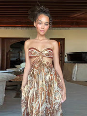 Woman wearing a patterned dress in an indoor setting