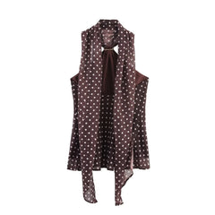 Brown sleeveless top with a polka dot scarf on a white background