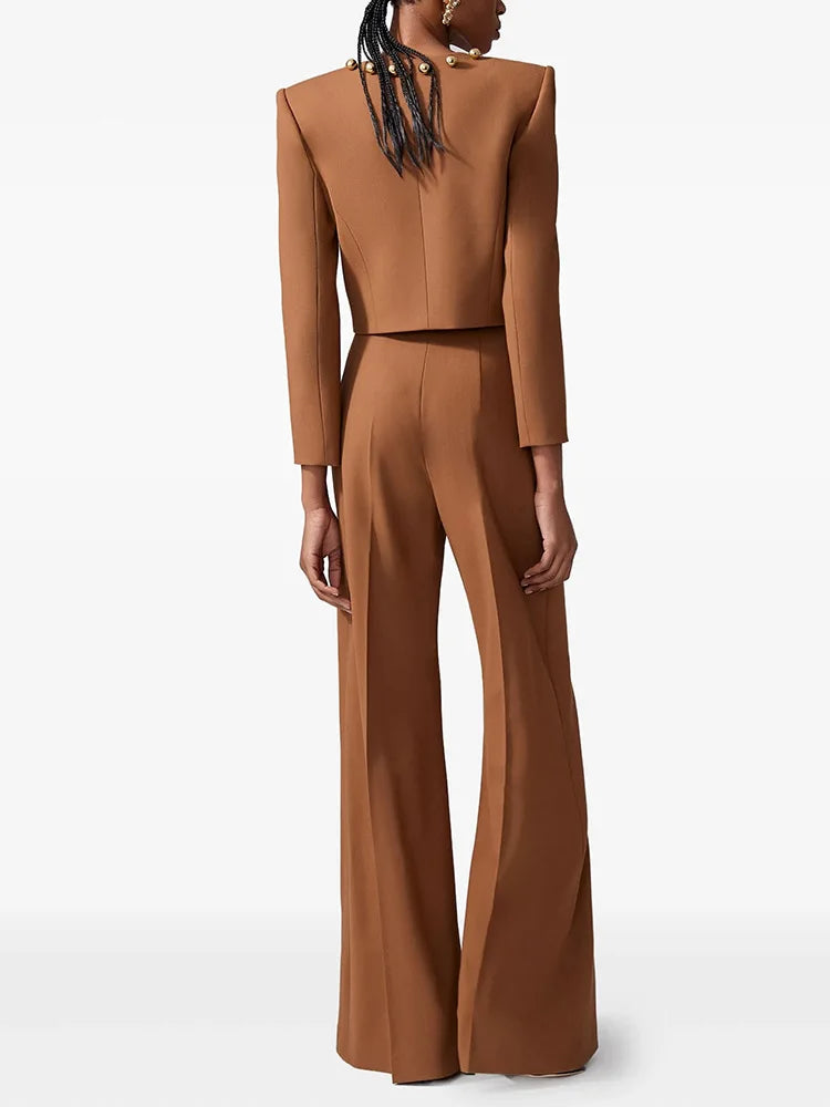 Brown cropped jacket with gold button detail and matching wide-leg trousers, back view.