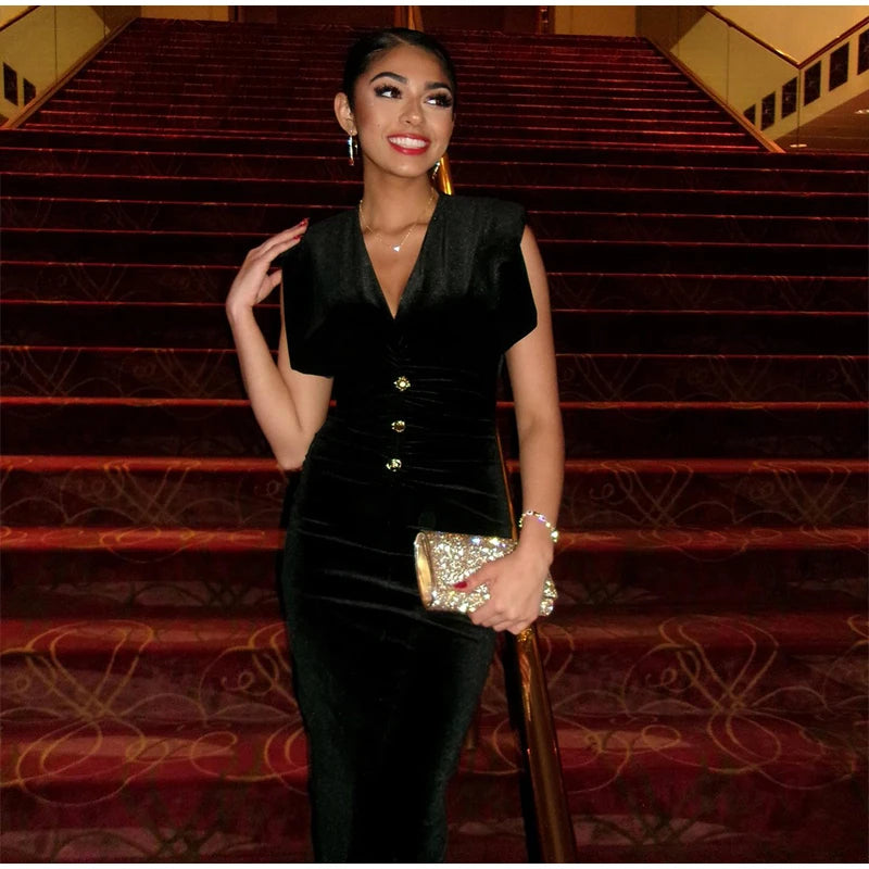Velvet v-neck midi dress with padded shoulders and ruched waist detail