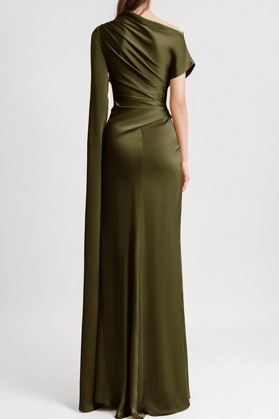 Green evening gown with a draped design on a white background