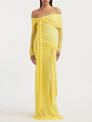 Off-shoulder draped gown dress with long sleeves and flowing skirt